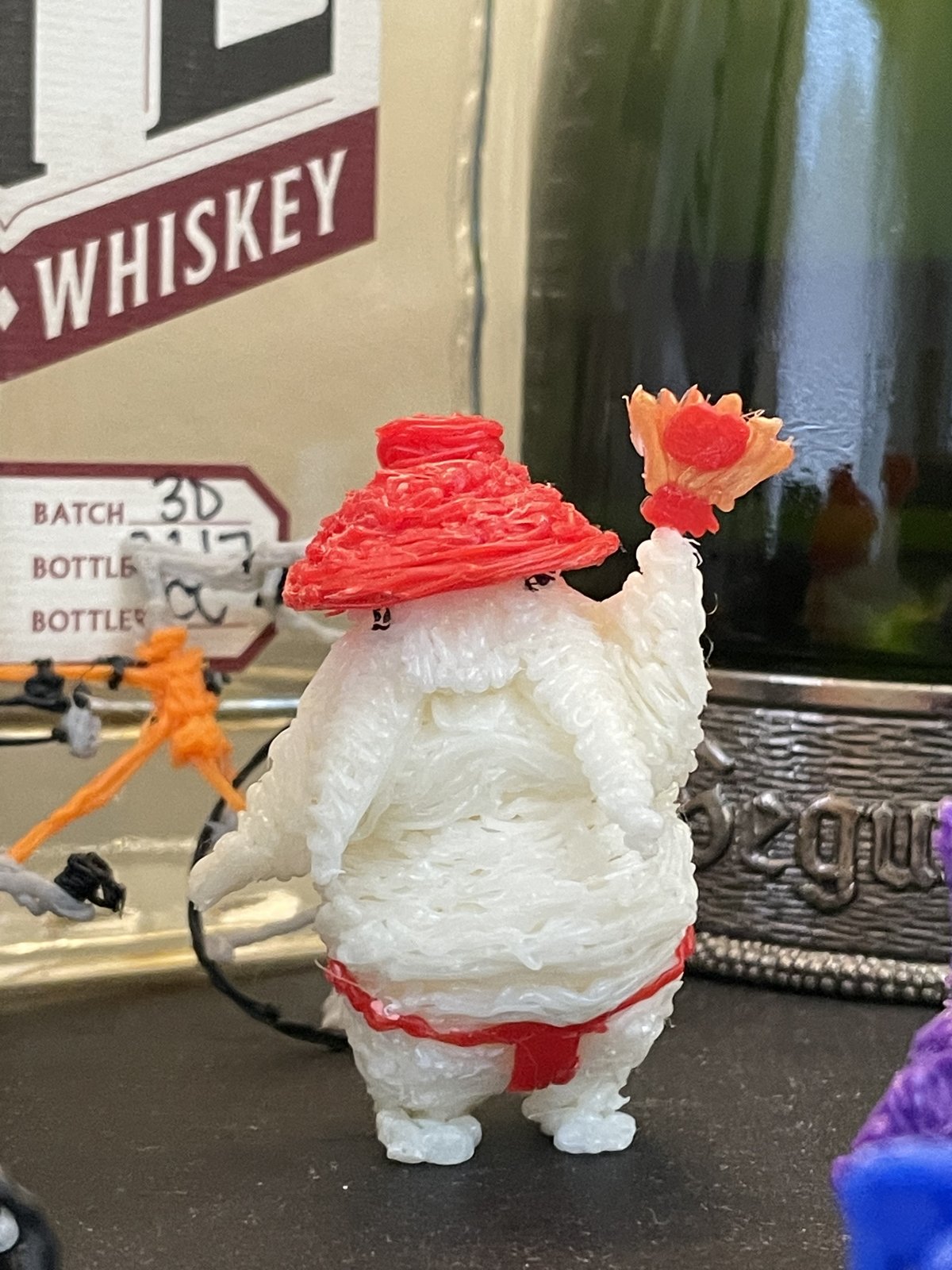 Artwork by Skyler Gallun &mdash; figure in red hat, view 1