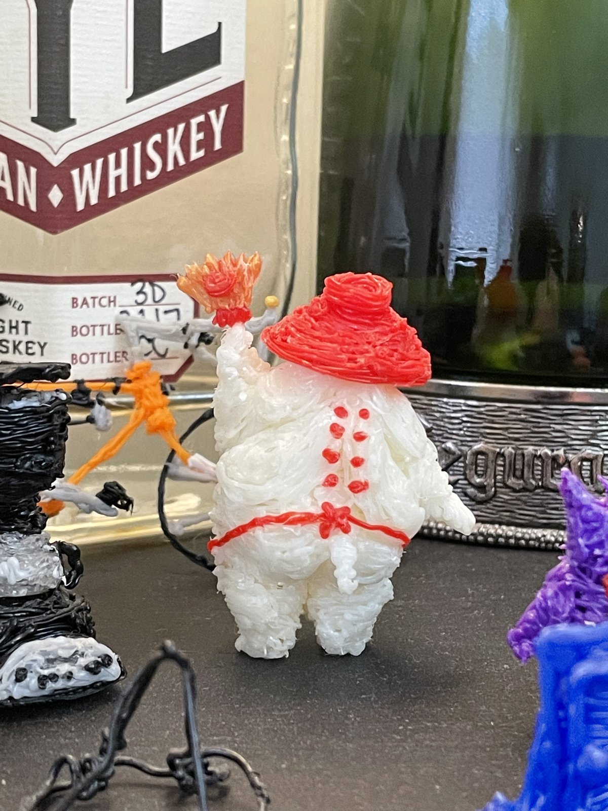 Artwork by Skyler Gallun &mdash; figure in red hat, view 2